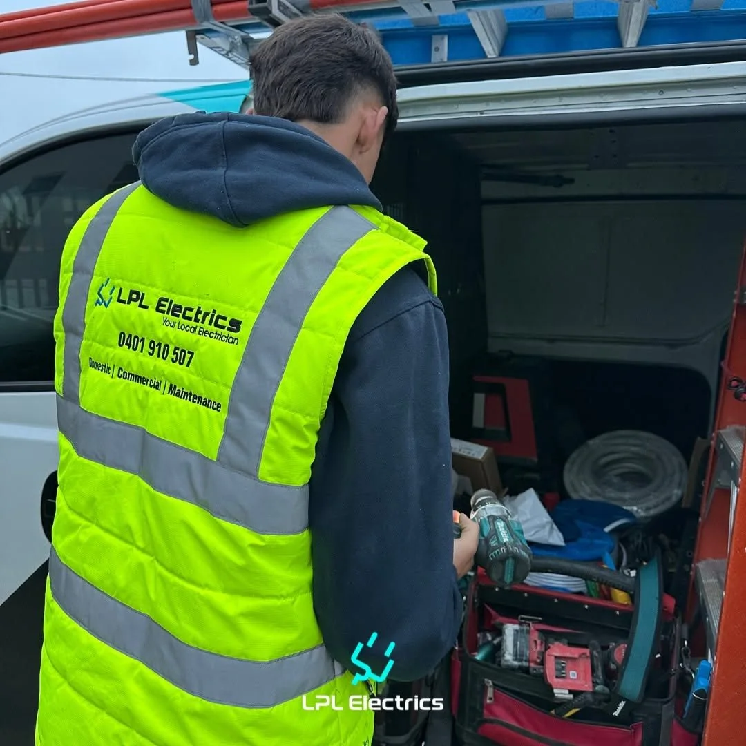 LPL Electrics electrician working from the back of a stocked work van