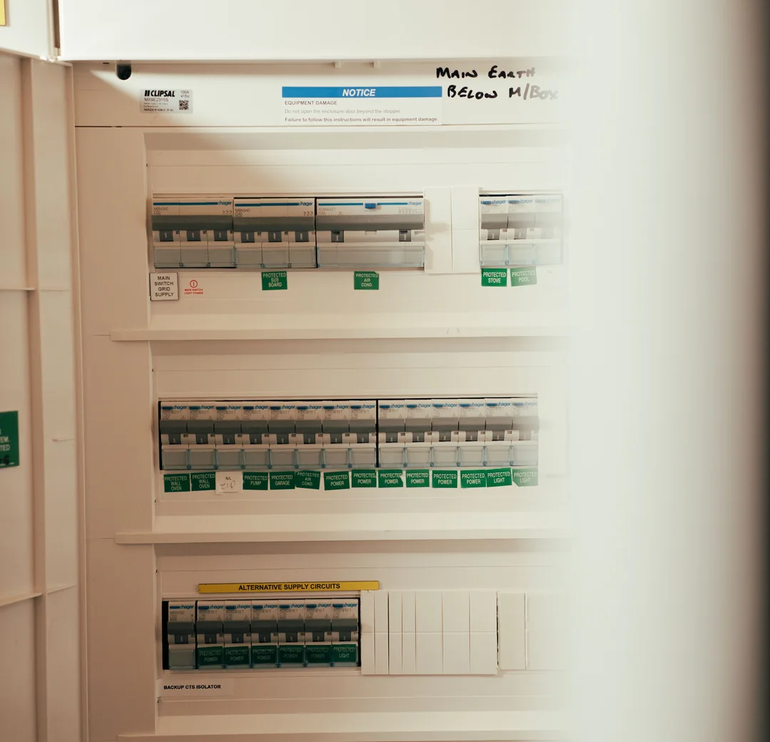 Open switchboard with rows of labelled circuit breakers