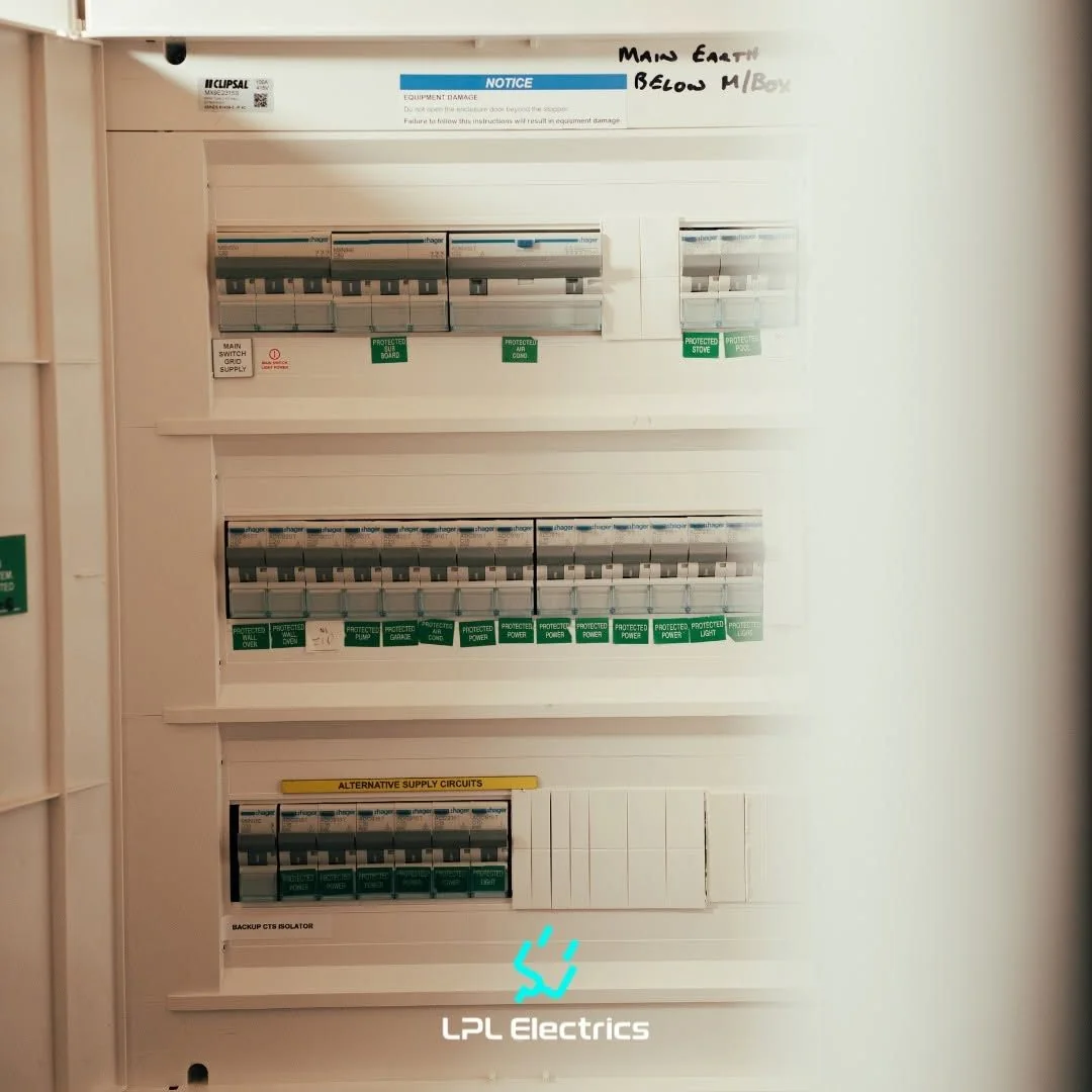 Close view of a switchboard with rows of labelled circuit breakers